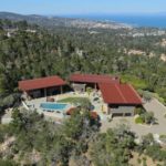 An-aerial-view-of-the-compound-with-the-Pacific-Ocean-beyond