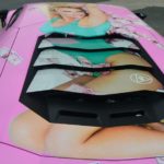 An-image-of-Pamela-Anderson-adorns-the-roof-of-the-car