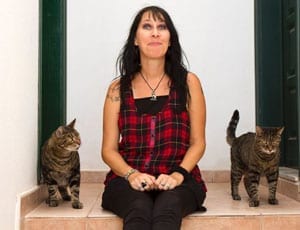 Barbara Buchner and her two pet cats Spider and Lugosi