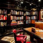 Hilfigers-study-features-bookshelves-with-The-New-York-Times-logo-above-them