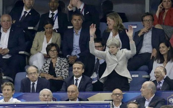Waving in the Wheat – Theresa May makes a berk of herself (again) – As Theresa May makes a berk of herself at a football game, gin hater William Hanson and Tory fop Jacob Rees-Mogg MP share their views on wheatfield running